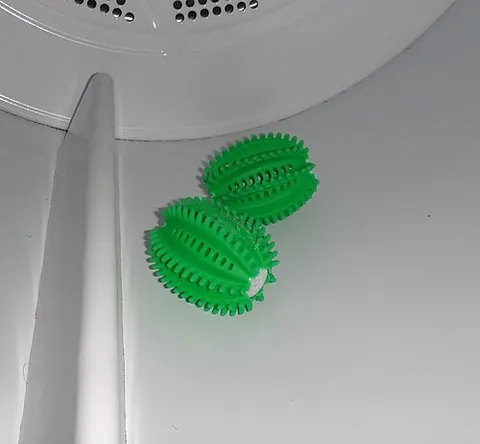 dryer ball: a ball-shaped object used in a tumble dryer to accelerate the drying process, soften clothes or...