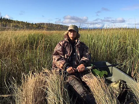 ducking coat: a short, warmly lined waterproof jacket, made in neutral colors or camouflage