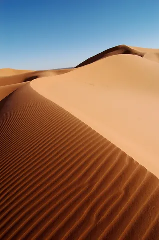 dune: a ridge or hill of sand piled up by currents of wind or water