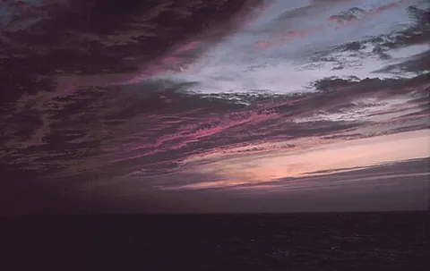 dusk: tending to darkness or blackness; moderately dark or black; dusky