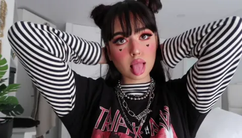 e-girl: a female member of the e-girl/e-boy subculture which emerged in the late 2010s, characterized by...