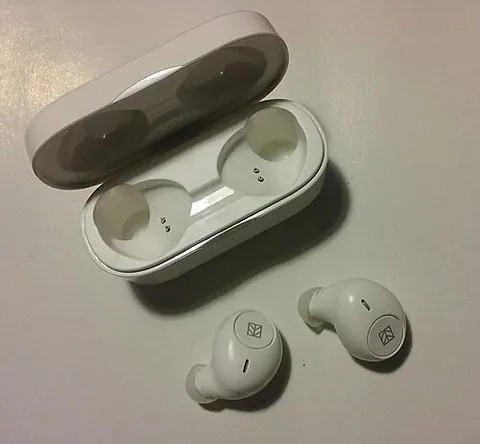 earbud: a small earphone designed to be placed in the ear canal for use with portable sound systems