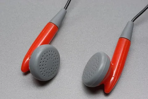 earpiece: a speaker placed inside or held near to the ear