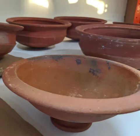 earthenware: an opaque, semi-porous ceramic made from clay and other compounds