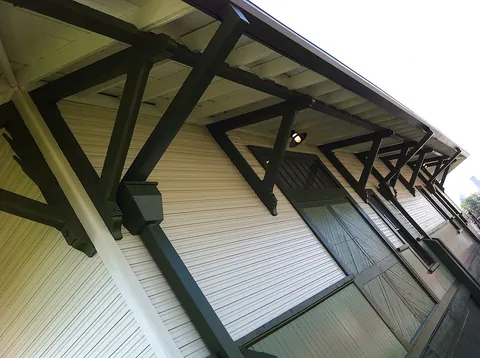 eaves: the underside of a roof that extends beyond the external walls of a building