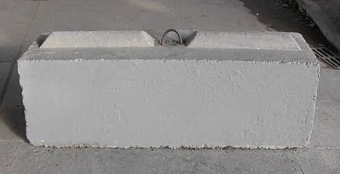 ecology block: a large concrete block with a groove in the bottom face and a tongue on the top face to eliminate...