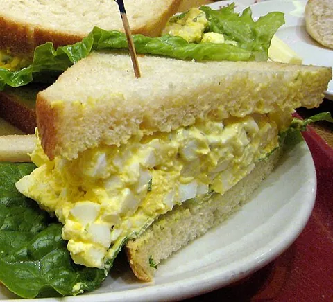 egg salad: a dish made primarily of chopped hard-boiled eggs and mayonnaise, often including other ingredients...
