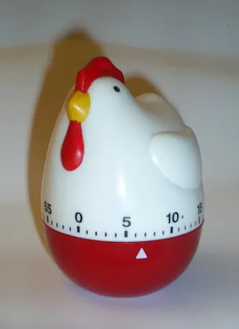 egg timer: a small version of an hourglass used to time the boiling of an egg
