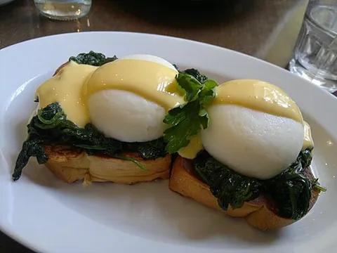 eggs florentine: a variation of eggs Benedict with spinach, sometimes in place of bacon