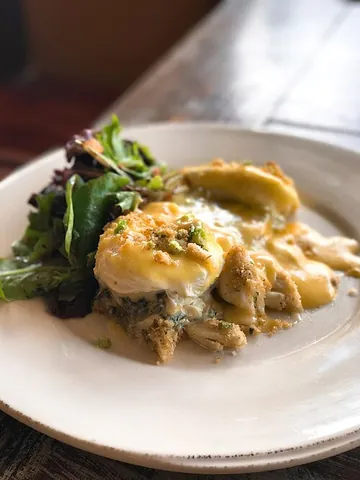 eggs sardou: a Louisiana Creole dish made with poached eggs, artichoke bottoms, creamed spinach and hollandaise...