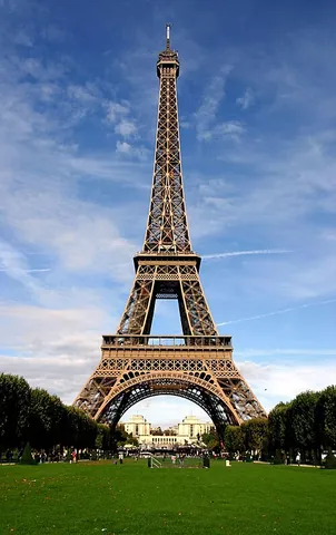 eiffel tower: an iron tower built in 1889 on the Champ de Mars beside the Seine River in Paris; a global icon of...