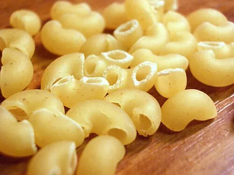 elbow macaroni: macaroni in the shape of a small tube curved into a semicircle