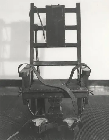 electric chair: a chair-like device used for performing execution by electrocution