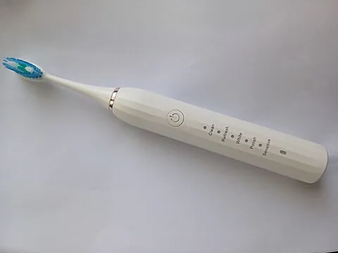 electric toothbrush: a toothbrush that uses electric power, usually supplied by a battery, to move the brush head rapidly