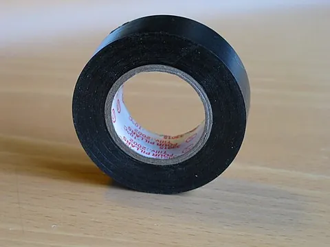 electrical tape: a poorly conductive plastic tape used to insulate electrical wires