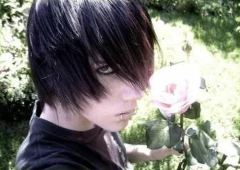 emo bangs: bangs swept down over the forehead which hang in or cover at least one eye
