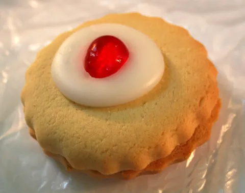 empire biscuit: a kind of sweet biscuit, typically two pieces of shortbread with a layer of jam between them and...
