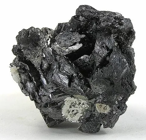 enargite: a steel gray, blackish gray, to violet black copper arsenic sulfosalt mineral with a metallic luster