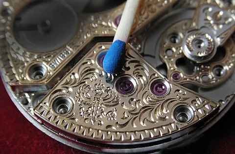 engraving: the practice of incising a design onto a hard surface, by cutting grooves into it