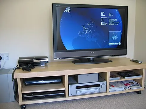 entertainment center: a piece of furniture designed to house and organize consumer electronic devices such as...