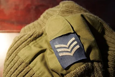 epaulette: an ornamentation, worn on the shoulders of a military uniform, as a sign of rank