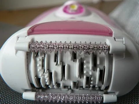 epilator: an electrically-powered device used for hair removal by mechanically grasping multiple hairs...