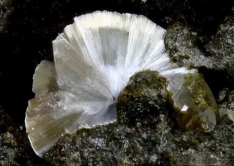 erionite: a zeolite mineral with a molecular structure similar to chabazite, usually found in weathered...