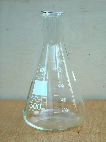 erlenmeyer flask: a glass laboratory flask of a conical profile with a narrow tubular neck and a flat bottom, used to...