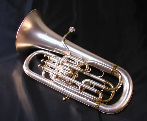 euphonium: a valved brass instrument with conical tubing similar in appearance to a tuba but of higher pitch