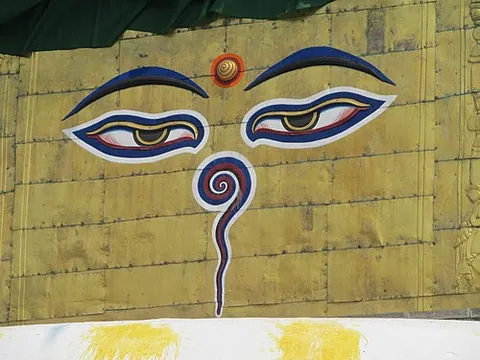 eyes of buddha: a symbol featuring two half-closed eyes that is popular in Buddhist art