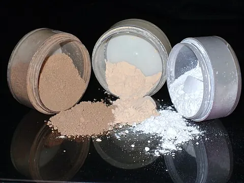 face powder: a cosmetic made from coloured talc, applied to the face