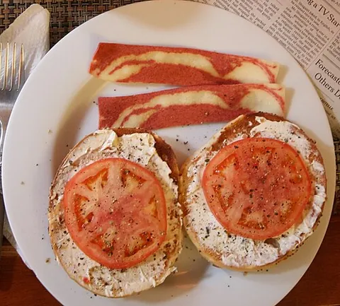 facon: vegetarian bacon; meat-free imitation bacon, generally made with tofu, tempeh, beans, or buckwheat