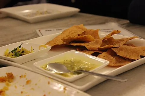 fafda: a crispy fried Gujarati snack made from gram flour and spices