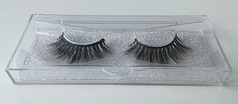 false eyelashes: a cosmetic enhancement in which synthetic or natural fibers are attached to the eyelids to give the...