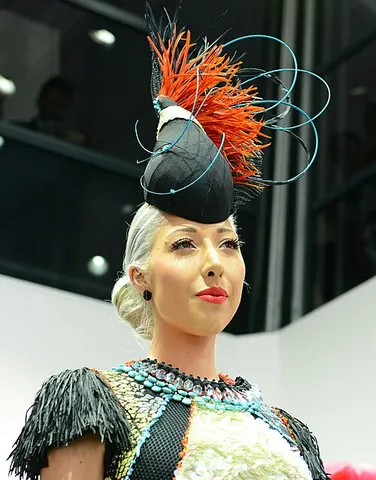 fascinator: a fascinating person or thing