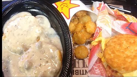fast food: restaurant food that is served quickly, often standardized and pre-prepared