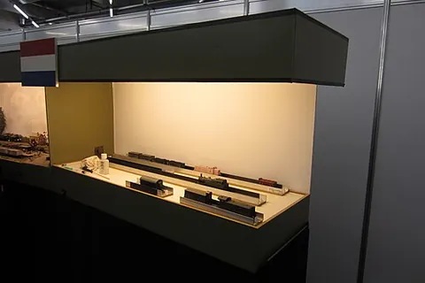 fiddle yard: a section of a model railway layout that is reserved for storing and working on trains, often...