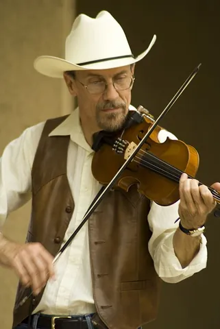 fiddle: a violin, a small unfretted stringed instrument with four strings tuned (lowest to highest)...