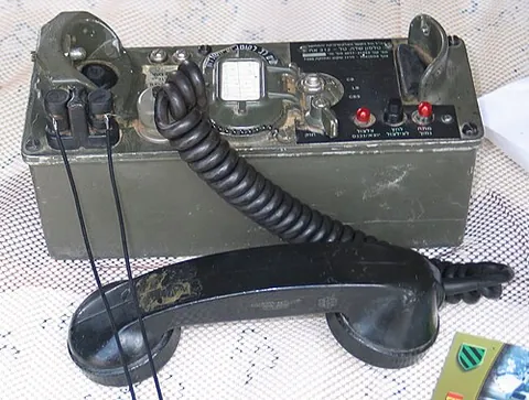 field telephone: a portable telephone used for military communication
