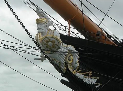 figurehead: a carved figure on the prow of a sailing ship