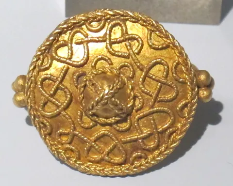 filigree: a delicate and intricate ornamentation made from platinum, gold or silver (or sometimes other...