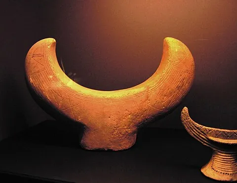 fire dog: bronze Age artifact used in worshipping either bulls or the moon, or as a holder for wooden logs to...