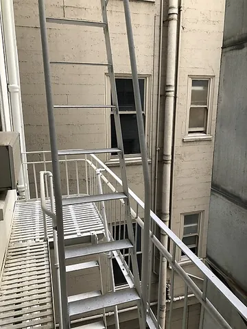 fire escape: any of the series of emergency doors, ladders, or stairs used to evacuate a building if a fire...
