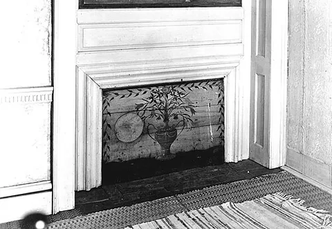 fireboard: a board or screen placed over a fireplace when it is not in use