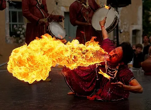 firebreather: a performer who creates fireballs by breathing a fine mist of fuel over an open flame