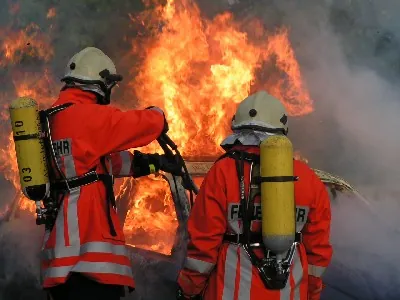 firefighter: a person who has been trained to put out fires