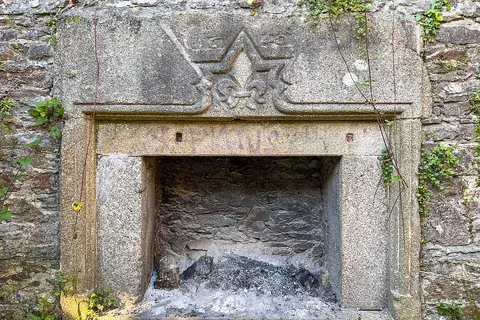 fireplace: an open hearth for holding a fire at the base of a chimney