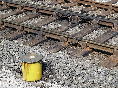 flange lubricator: a device installed in order to reduce wear to both wheel flanges and the rails in the railway track
