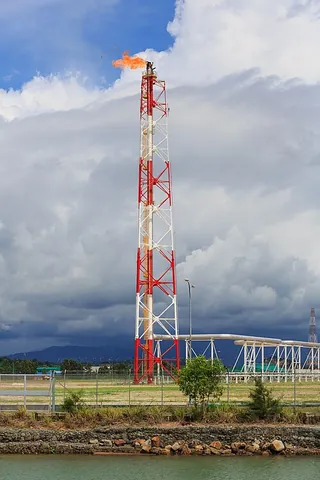 flare tower: a tall structure used for burning off waste gas at oil refineries and other installations