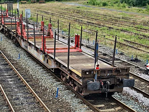 flat wagon: an open railway wagon without sides and roof, or with very low sides